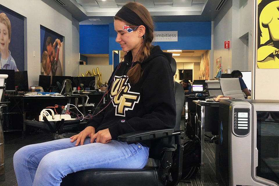 Limbitless intern Anna using the project xavier EMG-powered wheelchair.