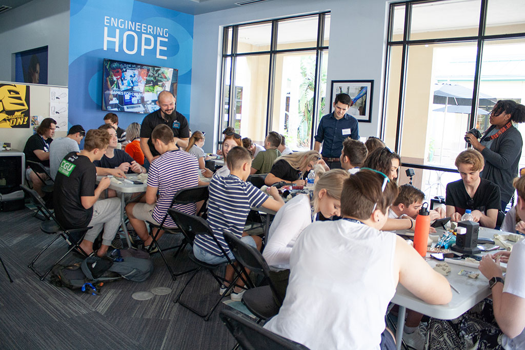 A group of students attending a workshop at Limbitless