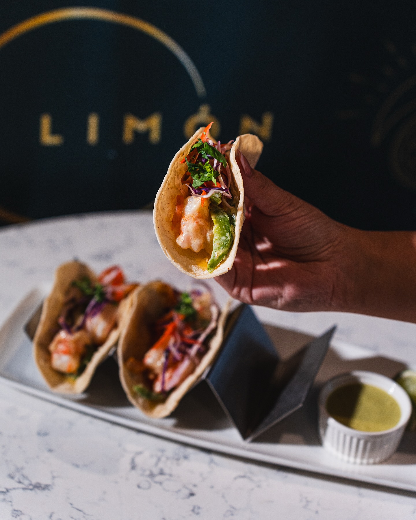 Vibrant cocktail with a lime garnish