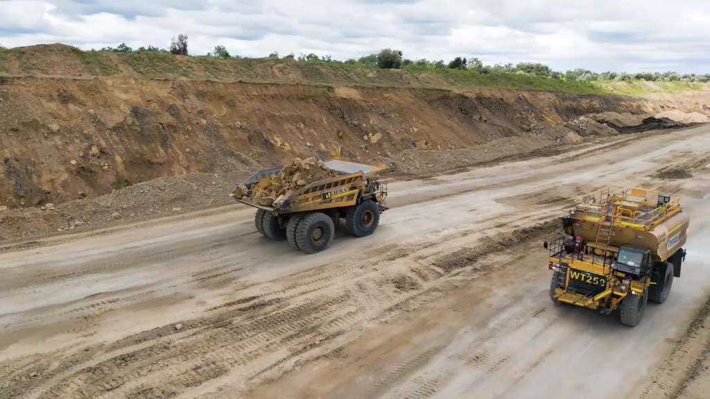 Worker killed and another injured after haul truck backs over vehicle at Queensland mine site