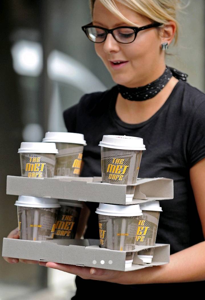 Woman, 52, charged after alleged assault on café worker in Melbourne on Anzac Day