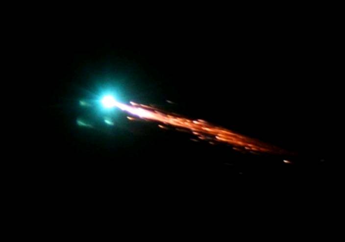 A bright streak of light moving across the night sky over Queensland.