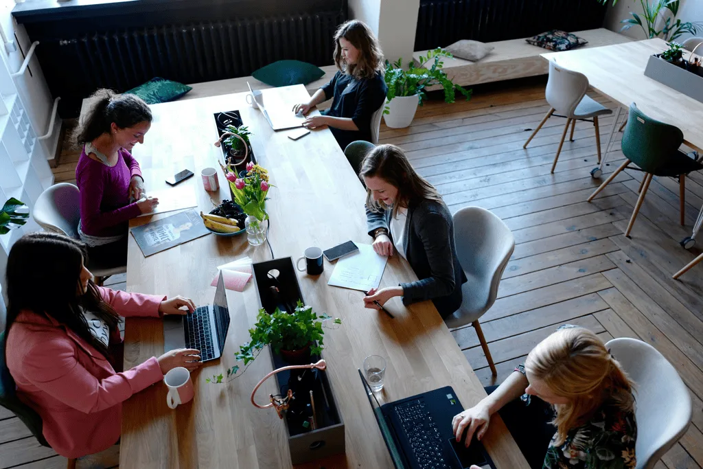 People working on computers in a shared workspace