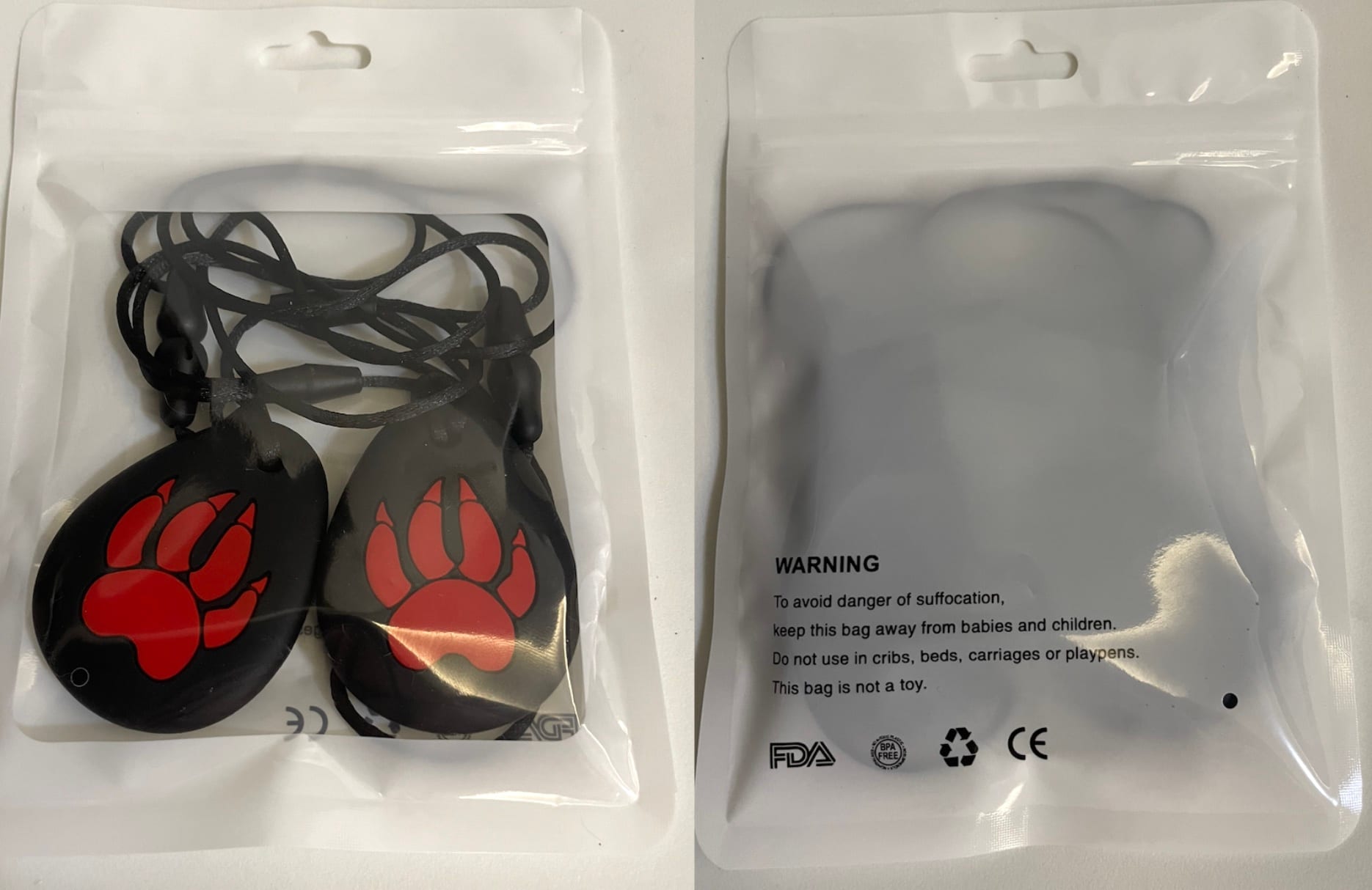 Paw-shaped sensory chewing necklace in compliant packaging.