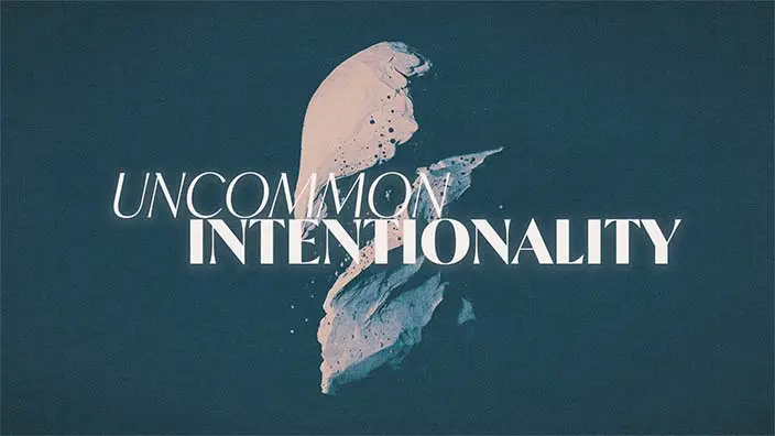 A breaking stone is in the background behind the words "Uncommon Intentionality."