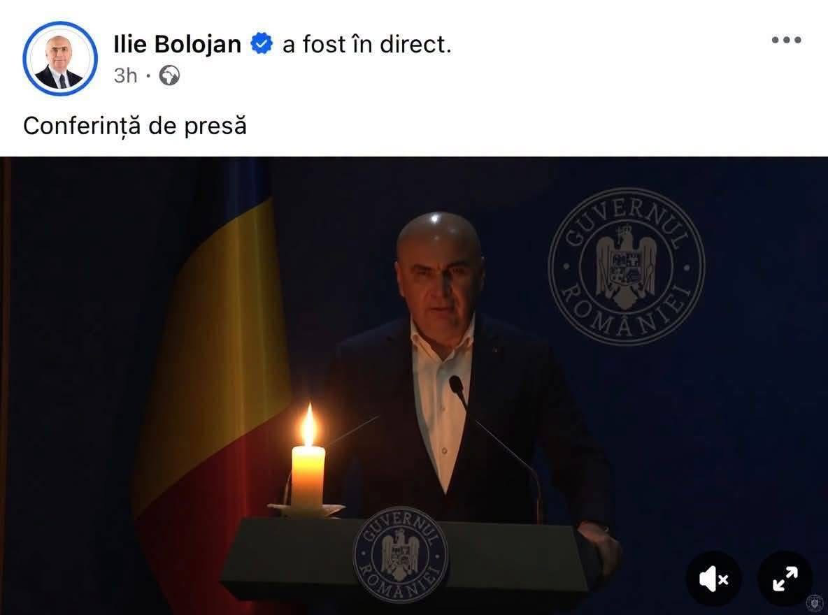 Ioie Bolojan cu lumânare aprinsă in timpul conferinței de presă