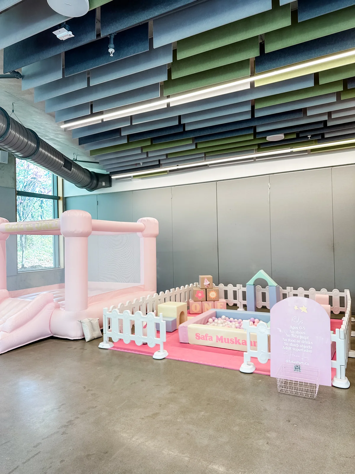 Pink and white soft play with slide, foam tunnel, pastel blocks, and deer bounce rider