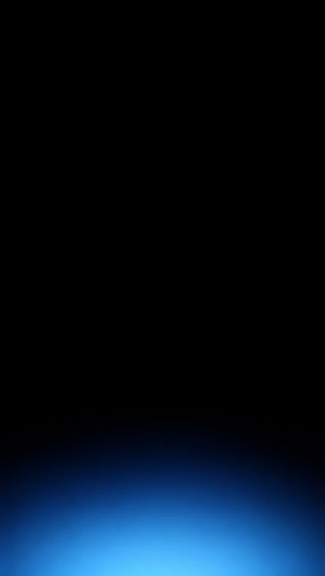 Near-total darkness. A tall black panel; at the very bottom, a faint cold cyan haze, like light seen from far above through mist.
