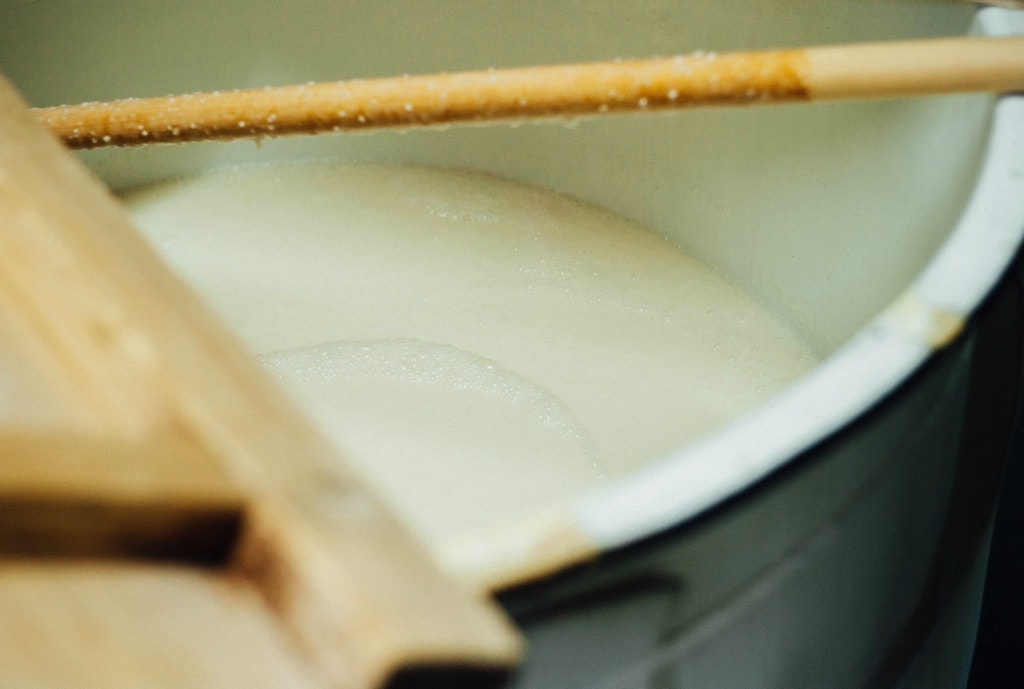 Close-up of fermenting moromi mash in a brewing tank