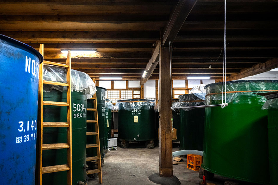 Rows of fermentation tanks inside the brewery