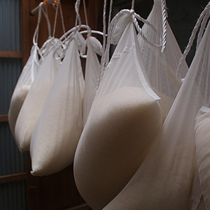 Sacks of rice mash hung for pressing (sase-shiki style)