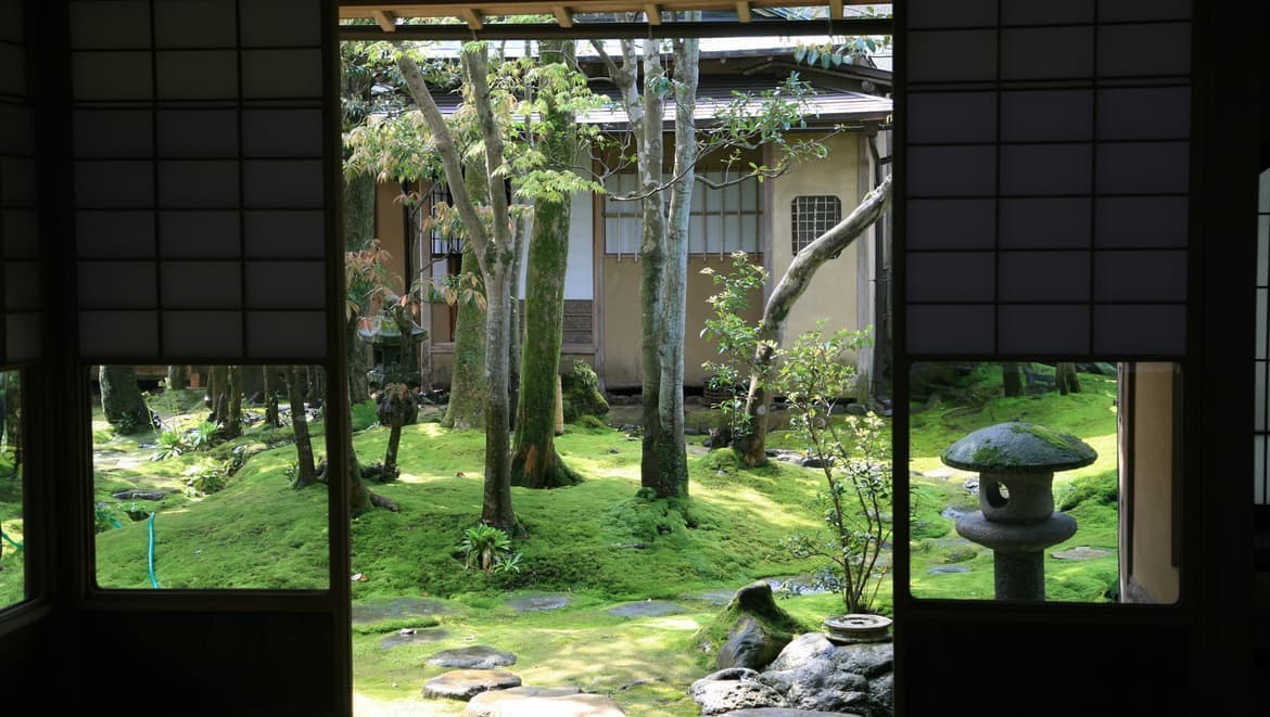 View from the Keishoan tea house sliding doors onto the moss garden and stone lantern.
