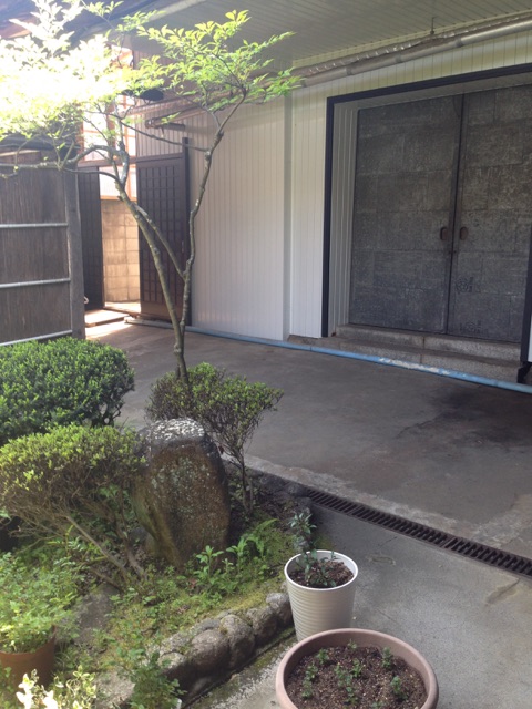 Courtyard and storehouse entrance behind the main building.