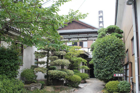 Approach through the garden to the brewery office entrance