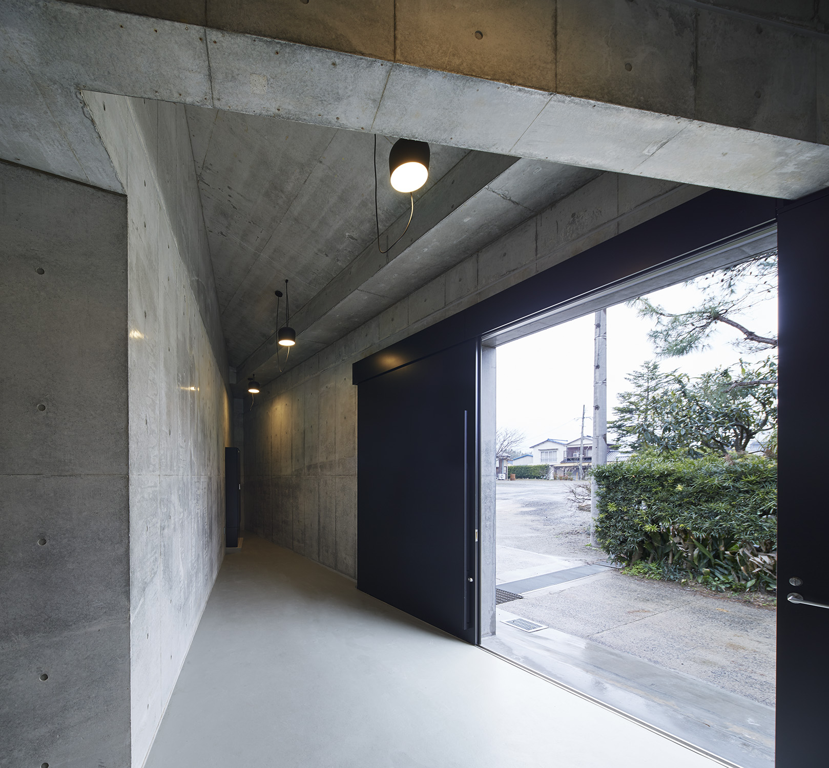 Interior corridor of the brewery's modern concrete extension.