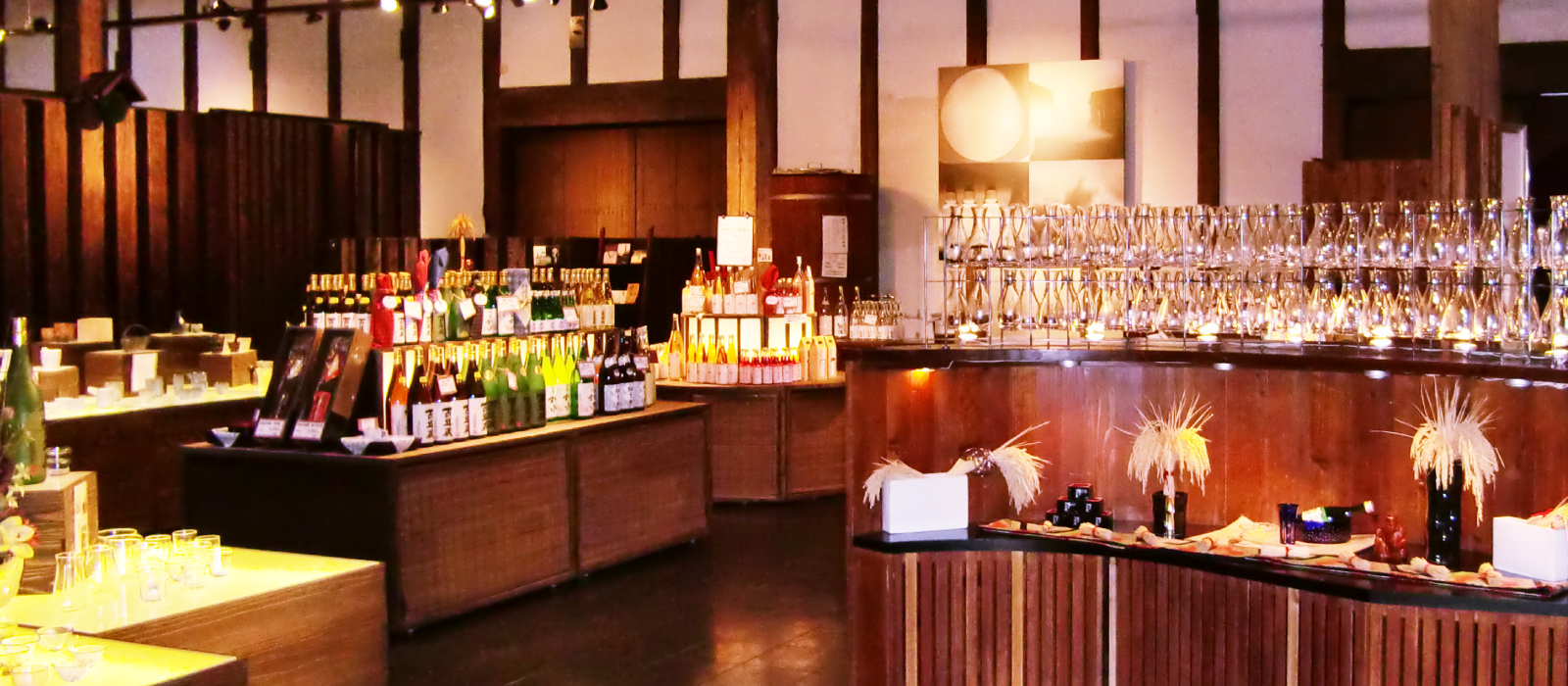 Interior of the brewery's direct-sale shop with sake bottles on display.