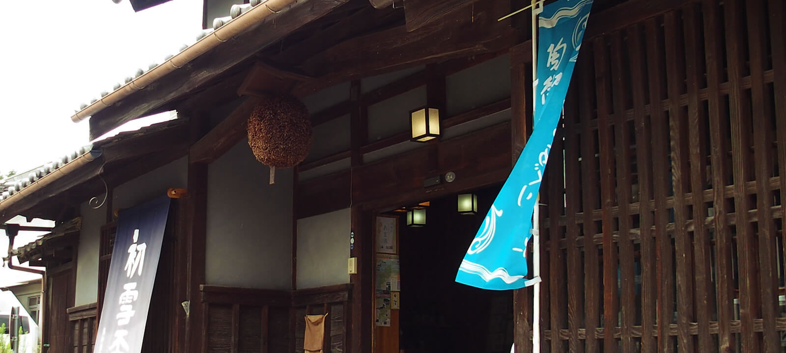 Brewery entrance with sugidama (cedar ball) and Hatsuyukihai banner