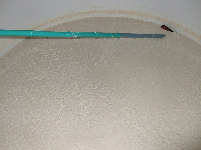 Close-up of fermenting moromi mash during the shibori (pressing) process.