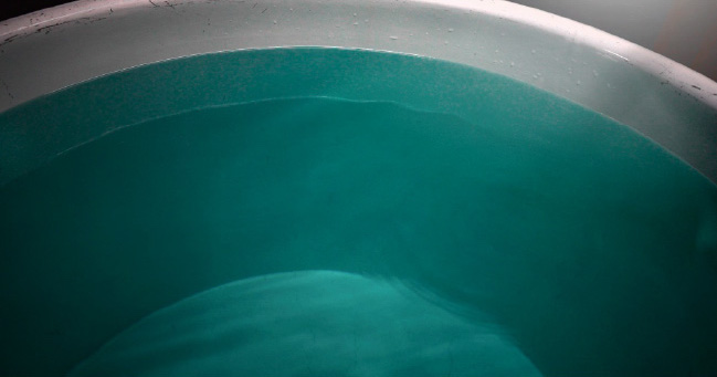 Close-up of the brewery's ultra-soft brewing water in a tank.