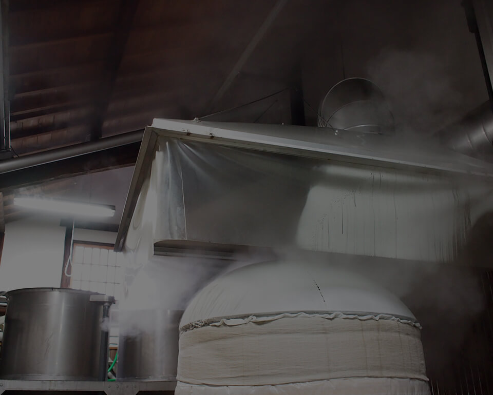 Steam rising from a tank during the brewing process