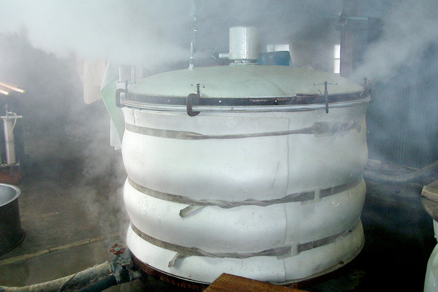 Rice steaming in the koshiki, filling the room with steam