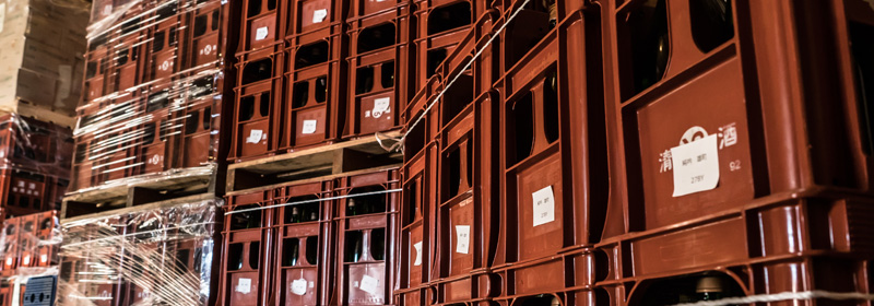 Cases of bottled sake stacked in the storage warehouse
