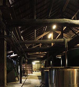 Interior of the original brewery building with fermentation tanks