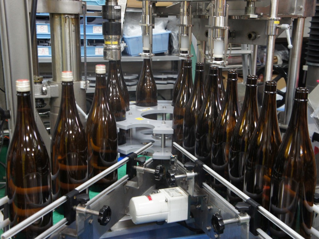 Bottling line equipment used for filling sake bottles.