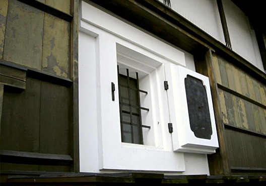 Traditional plaster storehouse window on the brewery building exterior