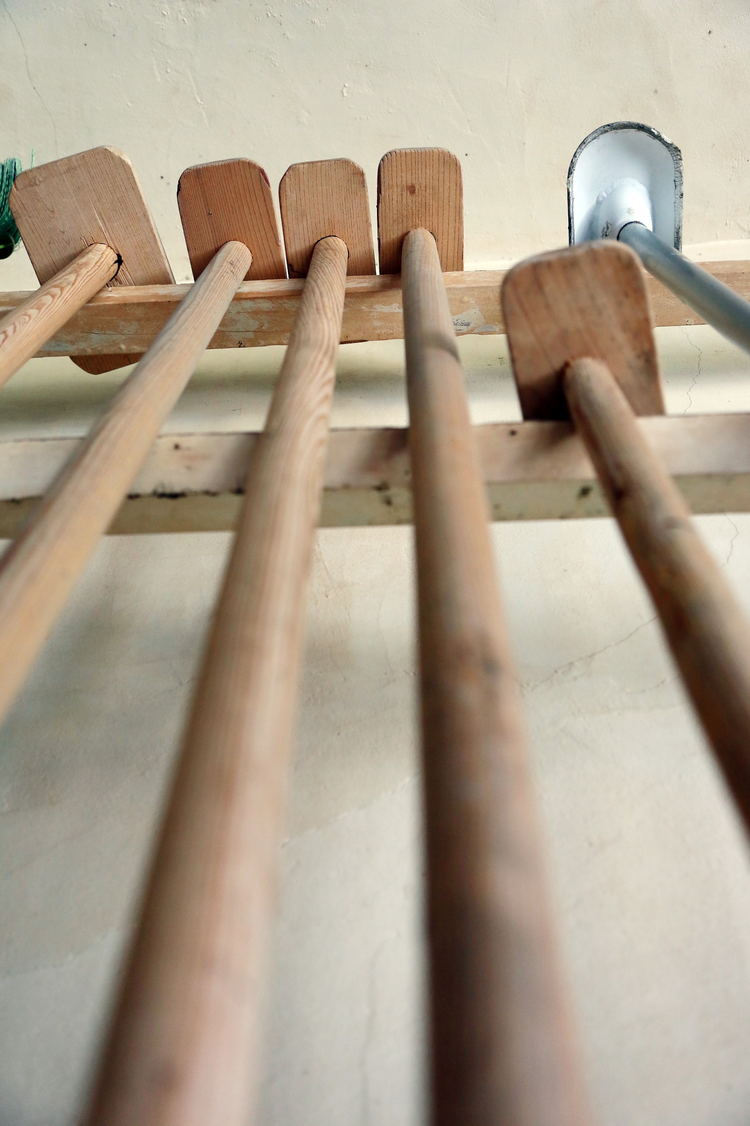 Traditional wooden brewing paddles and tools hung to dry inside the brewery.