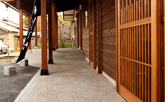 Covered walkway along the shop exterior