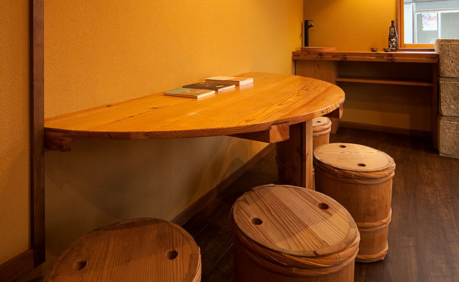 Interior counter seating with wooden barrel stools