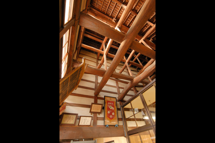 Exposed heavy timber roof trusses inside the century-old brewery building.