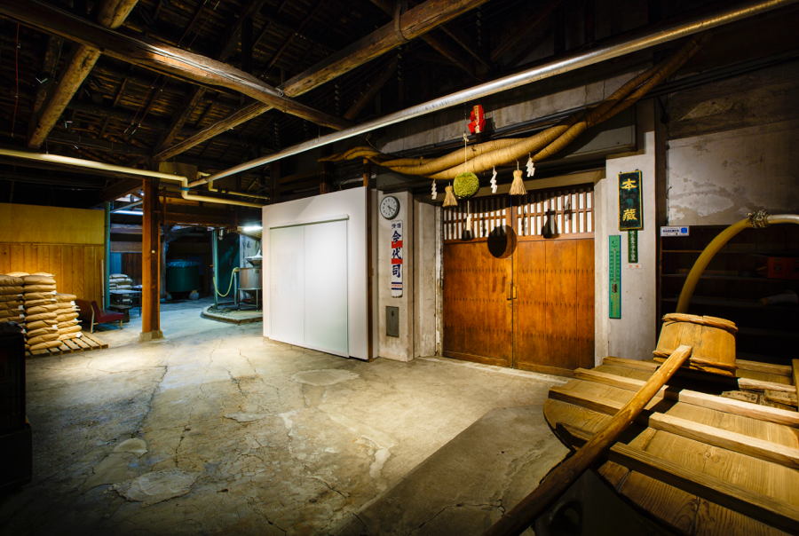 Traditional brewery interior with a cedar-ball sugidama hanging above the entrance