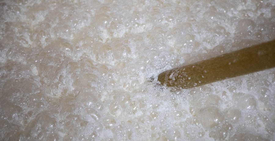 Close-up of fermenting moromi mash bubbling in a tank