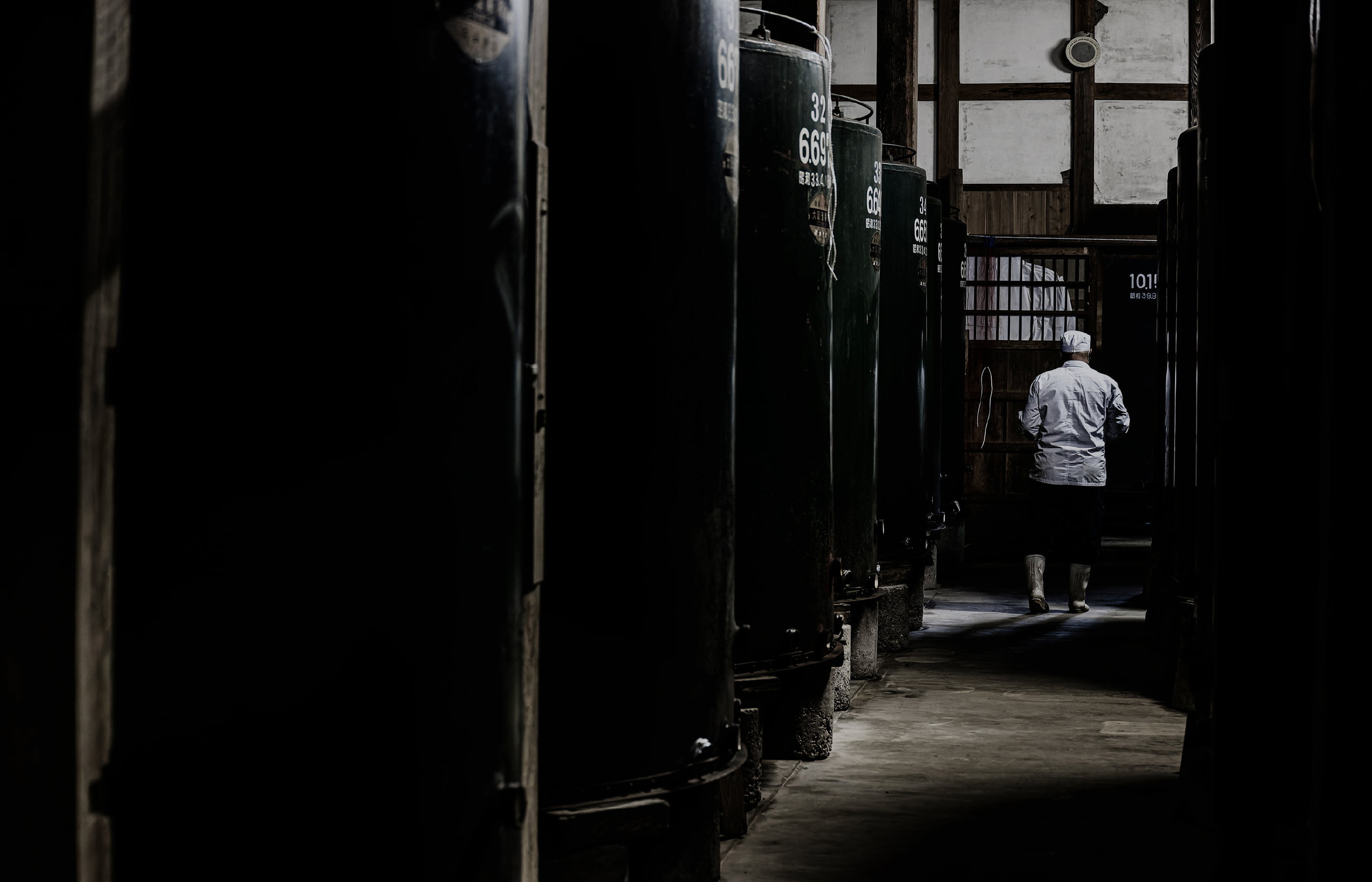 Rows of fermentation tanks inside the brewery.