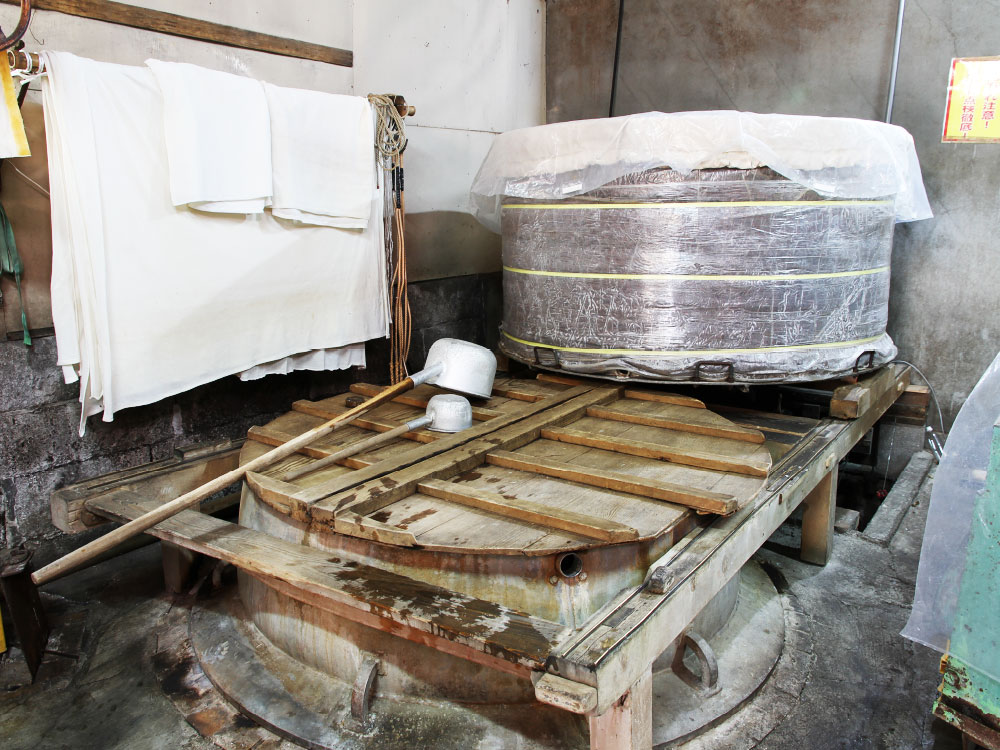 Traditional koji-making equipment and cloths used in the brewing process at Takeoka-kura.