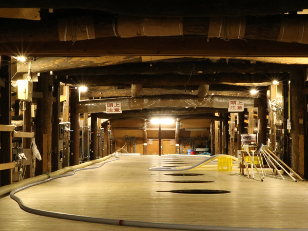 Traditional wooden-beamed interior of the brewing hall