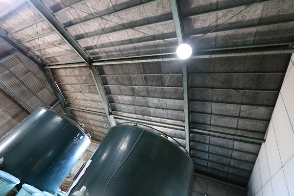 Storage tanks beneath the brewery's roof structure.