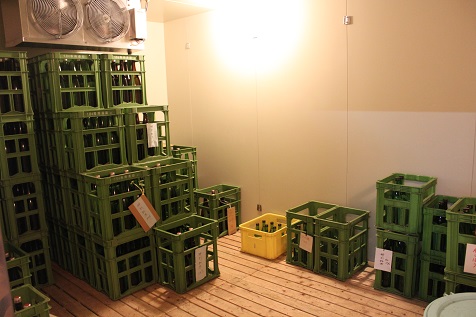 Refrigerated storage room holding crates of sake before shipment.