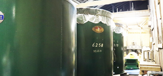 Fermentation tanks inside the Asahizuru brewery