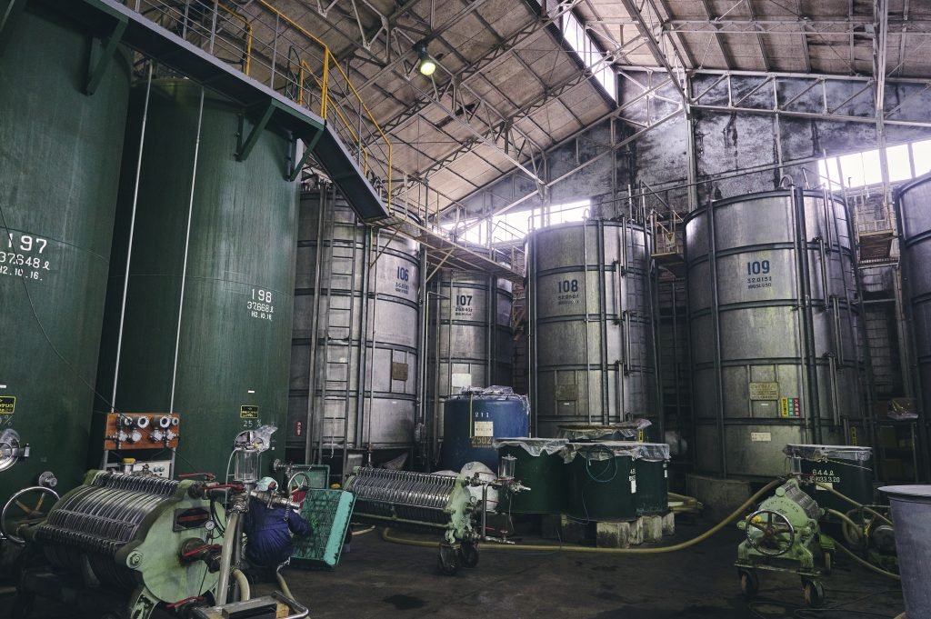 Large storage and fermentation tanks inside the production facility