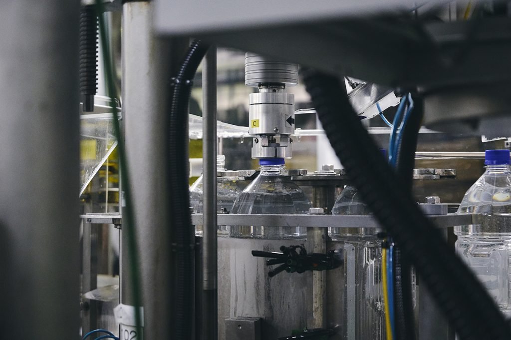Automated bottle filling equipment on the production line