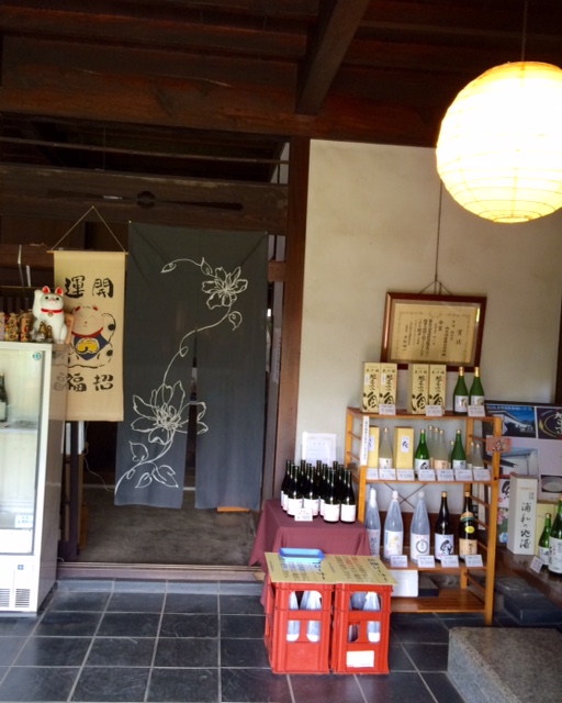 Interior of the brewery shop displaying bottled sake for sale