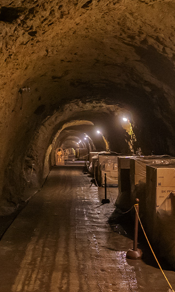 Cave tunnel corridor lined with storage crates