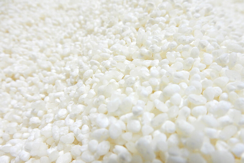 Close-up of polished sake rice grains used in brewing.