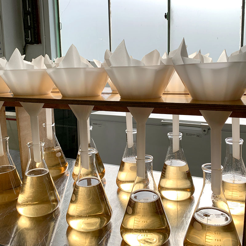 Filtration flasks used during the sake brewing and quality-check process.