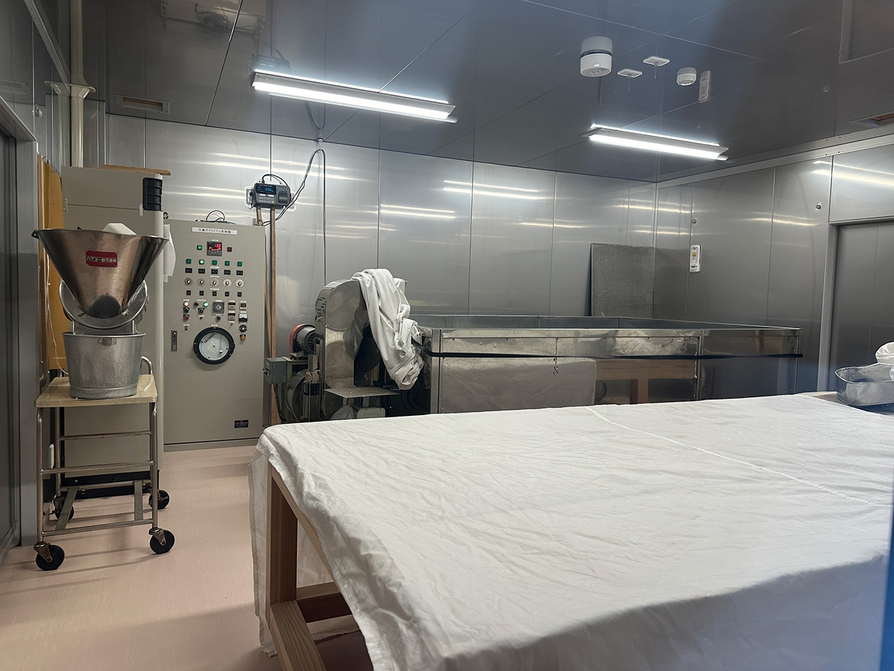 Koji-making room with steamed rice cloth and control panel