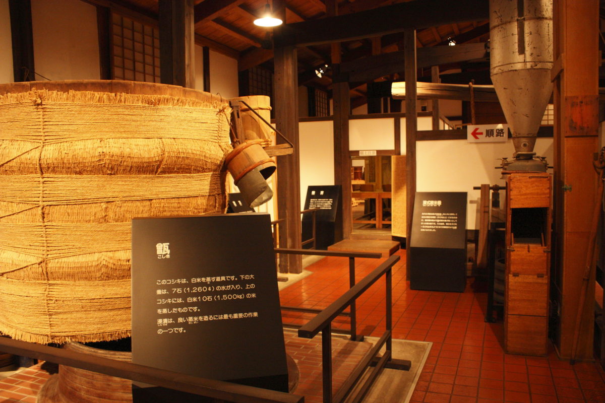 A traditional koshiki rice-steaming vessel on display inside the brewery museum.
