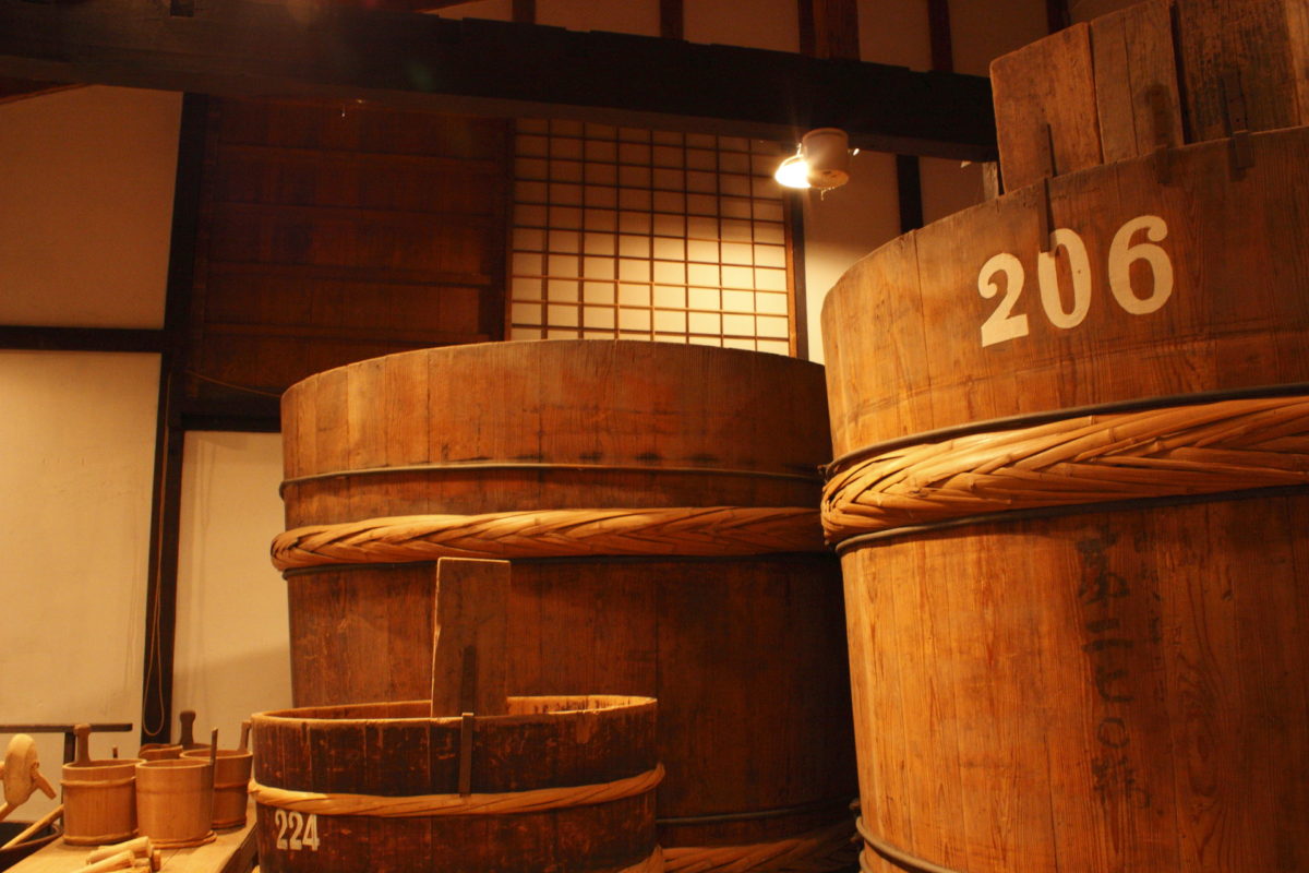 Large numbered wooden fermentation vats preserved in the brewery museum.